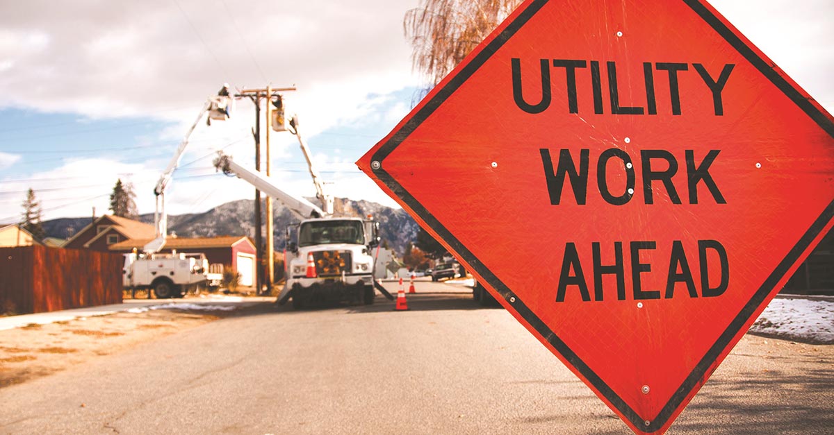 A caution sign reading "UTILITY WORK AHEAD."